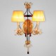 Eurofase 17500-012 - Festina Collections - 2-Light Wall Sconce - Gold Leaf/Ebony with Amber shade - B10 - E12 - 120V